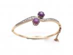 Antique two stone star ruby and diamond twist bangle in gold
