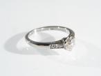 Platinum diamond flanked solitaire ring