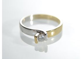 Contemporary two tone 18kt gold diamond solitaire twist ring