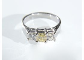 Fancy yellow square princess cut three stone ring
