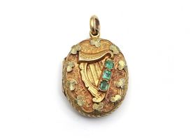 Antique Irish harp locket set with emeralds in yellow and green gold
