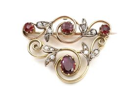 Garland style ruby and diamond brooch in yellow gold