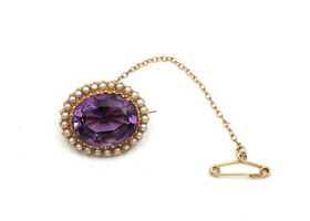Antique amethyst and seed pearl oval brooch in yellow gold