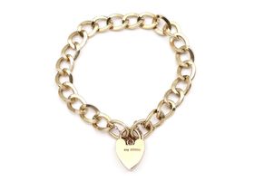 1967 oval curb link heart lock bracelet in yellow gold