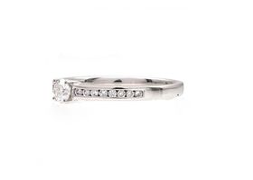 Flanked solitaire diamond engagement ring in 18kt white gold