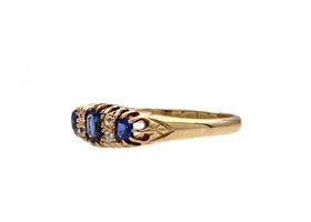 1910 sapphire and diamond three stone ring in 18kt yellow gold