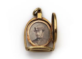 Victorian horse stirrup and horseshoe oval locket in gold