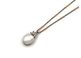 Antique baroque pearl and diamond pendant and two tone gold chain