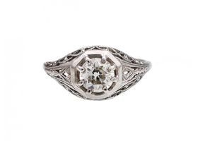 Vintage diamond solitaire openwork bombe ring